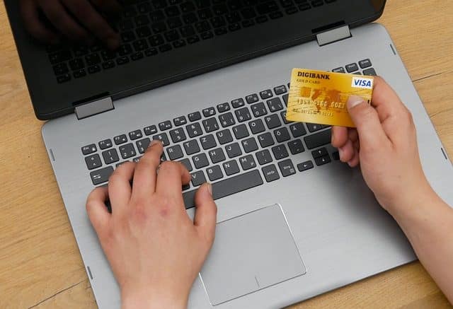 man paying online with visa card