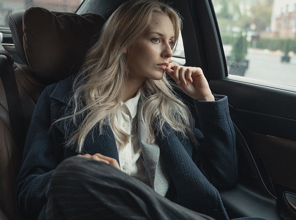 Young woman in car