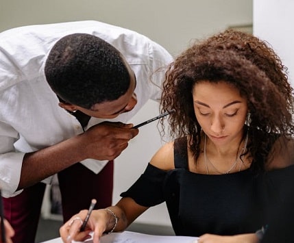 Male boss haranging female employee