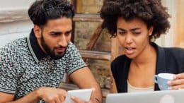 Young man and woman on laptop
