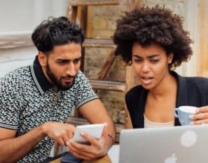 Young man and woman on laptop