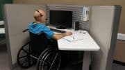 Man in wheelchair at his workstation