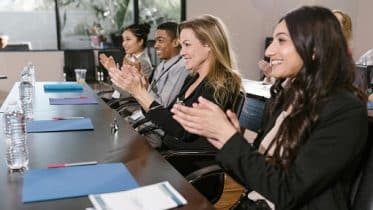 staff applauding a decision