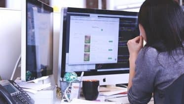 Woman watching PC screen