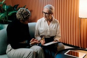 Woman therapist giving support to employee
