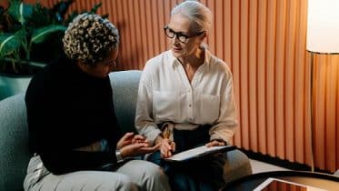 Woman therapist giving support to employee