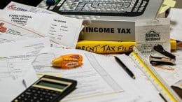 Busy desk with calculators and tax documents
