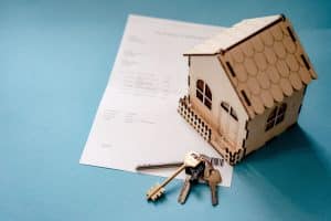 House, keys and contract collage